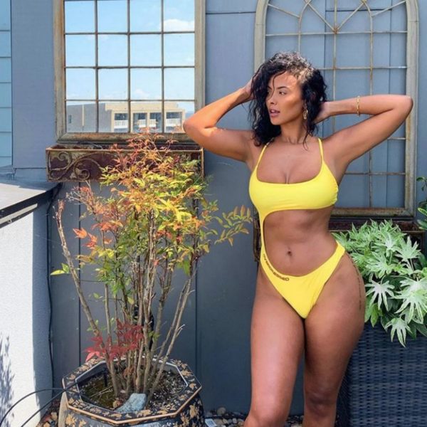 Maya Jama is posing in yellow bikini